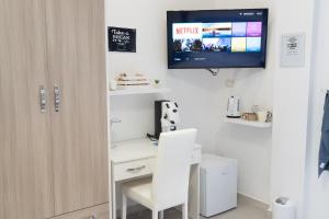 A television and/or entertainment centre at Terrazza Garibaldi