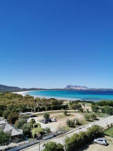 a view of a beach and the water at Hotel Onda Marina in San Teodoro