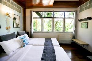 Letto o letti in una camera di Evergreen Pakchong Home