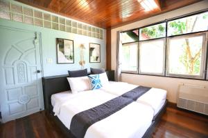 Letto o letti in una camera di Evergreen Pakchong Home