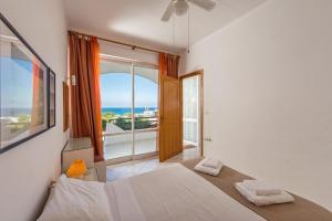 Postel nebo postele na pokoji v ubytování Rouladina Apartments