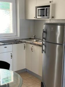 Kuchyňa alebo kuchynka v ubytovaní Villa Leo Beach Apartment