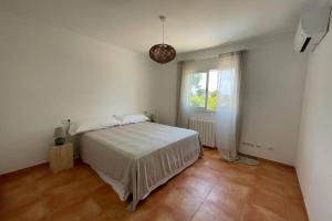 Łóżko lub łóżka w pokoju w obiekcie Casa Mar Blau - mediterranean house