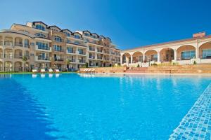 a large swimming pool in front of a building at Captain's Island Deluxe in Chernomorets