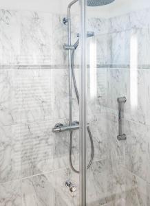 a shower with a glass door in a bathroom at WellenRausch Living "Nock" in Travemünde +38 photos
