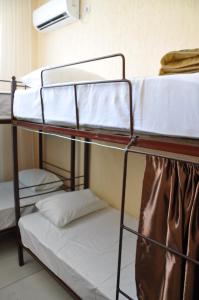 a couple of bunk beds in a room at Hostel - NS Prestige in Shymkent