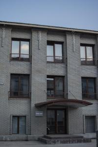 a brick building with balconies on the side of it at ESENIN-LocuS in Novosibirsk