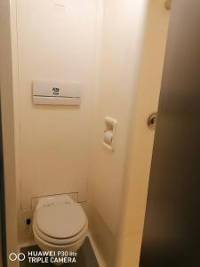a small bathroom with a toilet in a train at SUN1 Vereeniging in Vereeniging