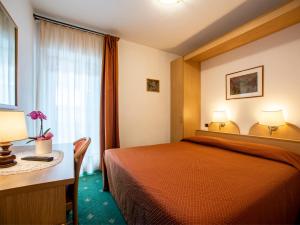 Voodi või voodid majutusasutuse Hotel Adriana toas