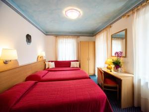 Voodi või voodid majutusasutuse Hotel Adriana toas