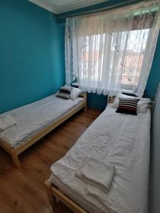 A bed or beds in a room at Mieszkanko na Wakacje