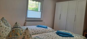 Postel nebo postele na pokoji v ubytování Ferienhaus Gänseblümchen