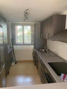 a small kitchen with a sink and a window at PedroRoca 285938-A Murcia Holiday Rentals Property in Torre-Pacheco