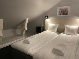 Postel nebo postele na pokoji v ubytování Unique Hotel Jungfrugatan