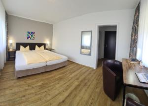 Postel nebo postele na pokoji v ubytování Hotel Neuenfels