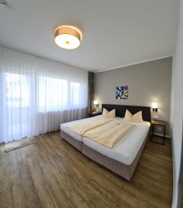 Postel nebo postele na pokoji v ubytování Hotel Neuenfels