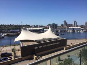 a large white tent on top of a building at Toothbrush Apartments - Ipswich Waterfront - Anchor St in Ipswich