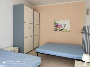 A bed or beds in a room at Appartamenti in Villa