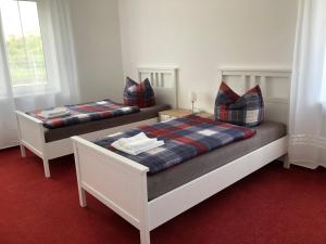 Postel nebo postele na pokoji v ubytování Jimmy Gastronomie & Übernachtung