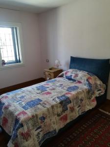 מיטה או מיטות בחדר ב-Villa Sogno
