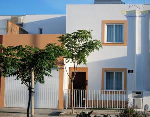 a white building with trees in front of it at Casa do Corval in Aldeia do Mato