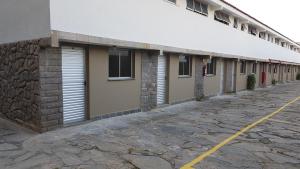 a row of buildings with doors and windows at Sleep Suites in Belo Horizonte