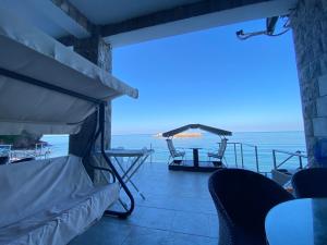 a view of the ocean from the balcony of a house at Apartments Lungo Mare in Sveti Stefan