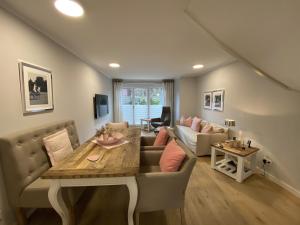 a living room with a couch and a table at Haus Oscar in Westerland in Westerland (Sylt)