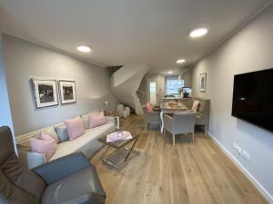 a living room with a couch and a table at Haus Oscar in Westerland in Westerland (Sylt)