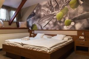 מיטה או מיטות בחדר ב-Oliva Hotel