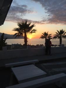 a man standing in front of the beach at sunset at Nonna Febronia in Patti