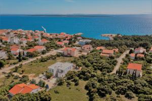 an aerial view of a small town next to the water at Lavender House in Mandre