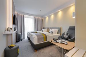 Postel nebo postele na pokoji v ubytování Holiday Inn Express - Fulda by IHG + 29 fotografií