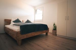 Postel nebo postele na pokoji v ubytování Landart-Appartements