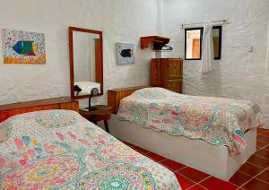 Voodi või voodid majutusasutuse Hostal Galapagos by Bar de Beto toas