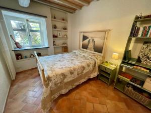 A bed or beds in a room at Il frantoio di Luna - Levanto, 5 Terre