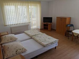 Voodi või voodid majutusasutuse Pokoje Gościnne - Leśna 8 toas