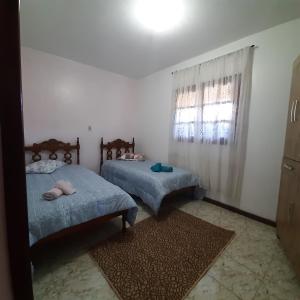 Tempat tidur dalam kamar di Casa Quintanilha