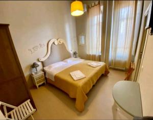 Postel nebo postele na pokoji v ubytování hotel lisà