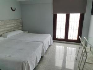 Postel nebo postele na pokoji v ubytování Hotel La Quinta
