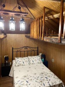 מיטה או מיטות בחדר ב-2 bedrooms house with wifi at Tineo