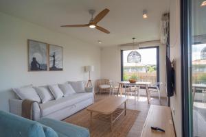 A seating area at OCEANSUITESLANGRE