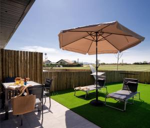 A patio or other outdoor area at OCEANSUITESLANGRE