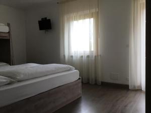 Cama o camas de una habitación en Rifugio Capanna Bill