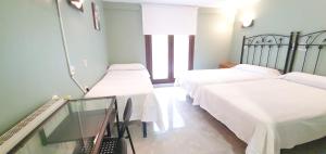 Postel nebo postele na pokoji v ubytování Hotel La Quinta