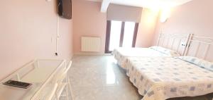 Postel nebo postele na pokoji v ubytování Hotel La Quinta