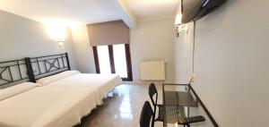 Postel nebo postele na pokoji v ubytování Hotel La Quinta