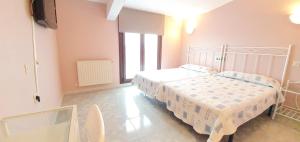 Postel nebo postele na pokoji v ubytování Hotel La Quinta