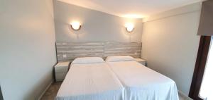 Postel nebo postele na pokoji v ubytování Hotel La Quinta