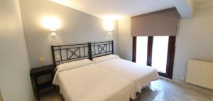 Postel nebo postele na pokoji v ubytování Hotel La Quinta